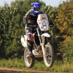 Husqvarna TE630 Rally bike airborne over a jump.